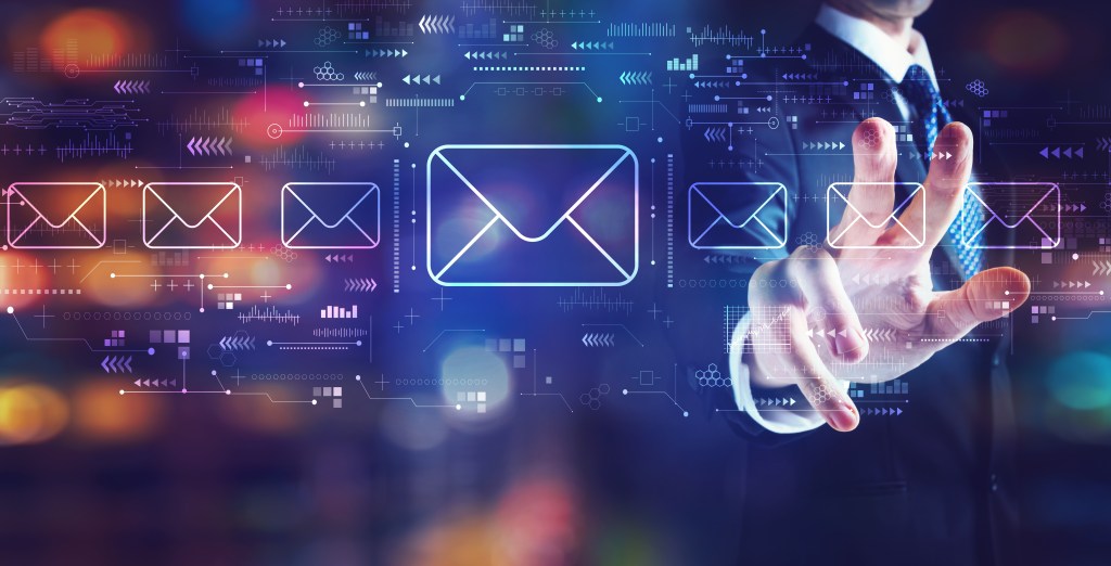 Email concept with businessman on night city background. Meant to showcase the importance of cold email marketing.