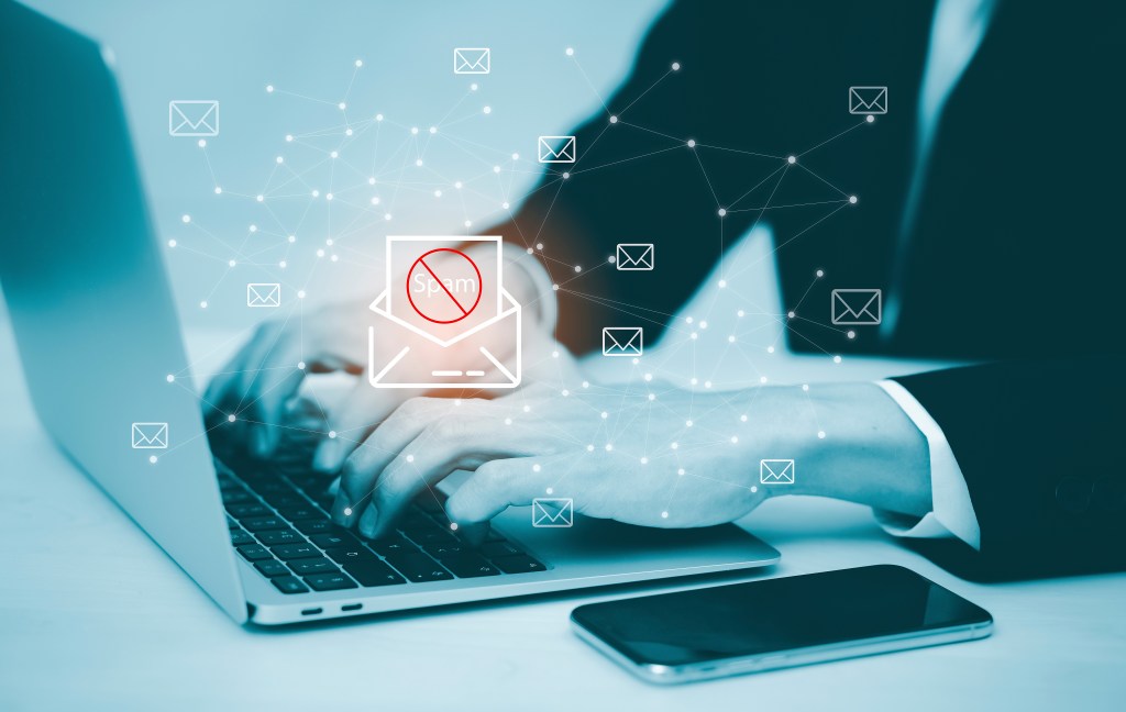 Spam warning on mans laptop.