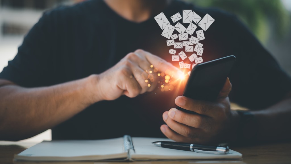 Email concept showing letters leaving a cell phone.