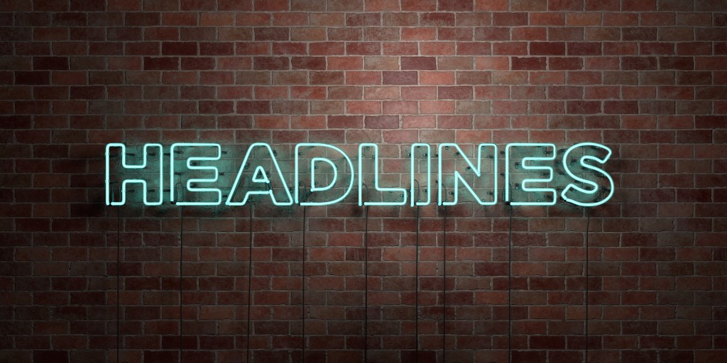 HEADLINES - fluorescent Neon tube Sign on brickwork - Front view - 3D rendered royalty free stock picture. Can be used for online banner ads and direct mailers.