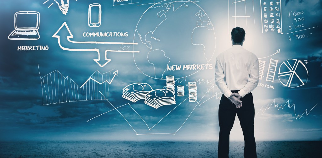 A professional man looking over different aspects within his own business considering DIY vs pro web design.