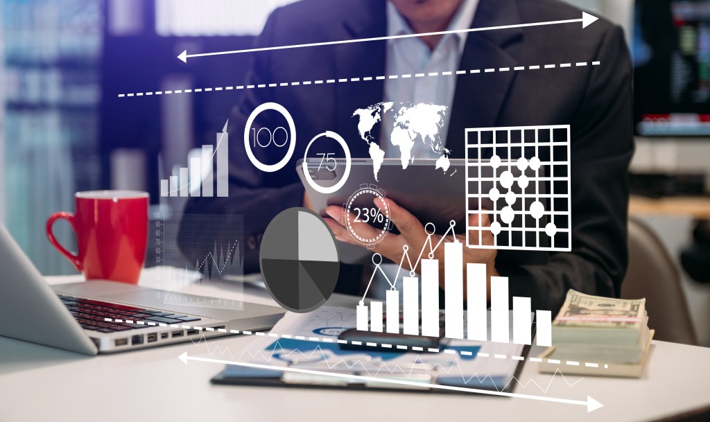 Data Management System with Business Analytics concept. business team hands working overtime trying to keep up with demands and DIY web design.